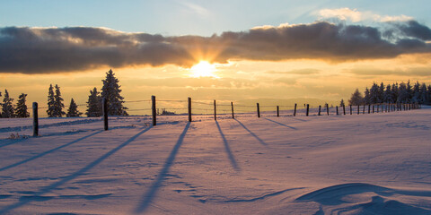 Idyllic winter scene with sunset in Austria