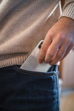 Crop Man Taking Out Smartphone From Pocket