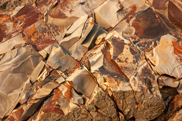 Side view of a part of a mountain of sedimentary rocks, a unique kind of faults, cracks, faults, folds.