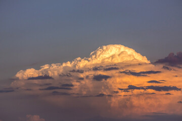 Orange clouds on dark blue sky before a summer storm in Minnesota USA