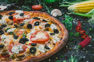Tasty seafood pizza with cherries on a wooden table