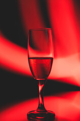 Fototapeta na wymiar glass glass with champagne on a multicolored background