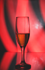 glass glass with champagne on a multicolored background