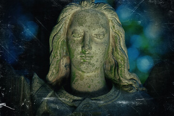 Angel of peace. Retro styled image of an ancient stone statue.