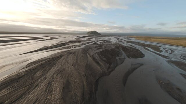 Fast FPV drone flying low over rivers landscape in Iceland