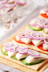 Obraz na płótnie Canvas Sandwiches with herring and vegetables