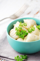 Russian national dish pelmeni served in a plate