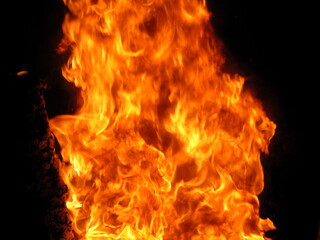 Detailed view of the flames. Close up. Orange and yellow.