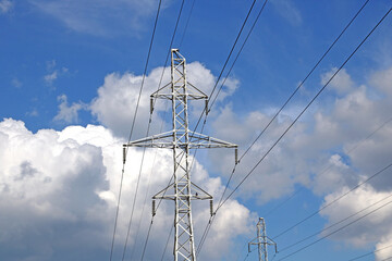 High voltage power lines against the background of the sky.