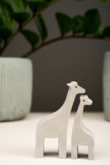 figurine toy animal handmade concrete and plaster mom and baby giraffe for playing with children and minimalistic decor and home decoration.