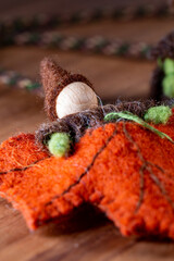 Gnome in an autumn maple leaf.