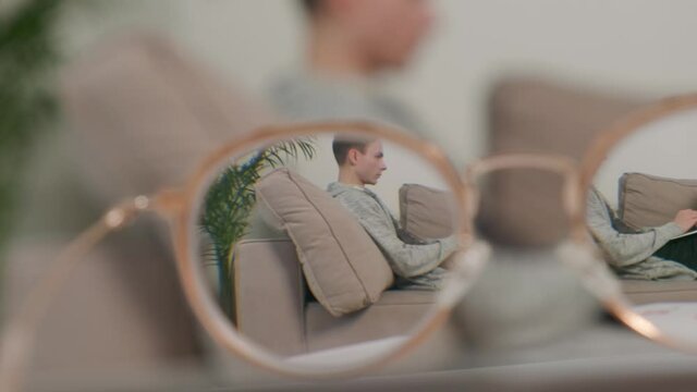 A view through glasses of a working young male freelancer. The concept of view.