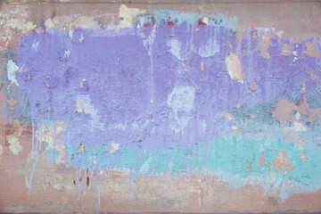 
The street wall is shabby, painted purple, green and coral. Space for copy space and text, background image