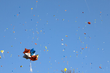 Bunches of colorful balloons in the blue sky