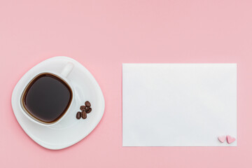 Love letter and white cup of coffee. pearlescent envelope