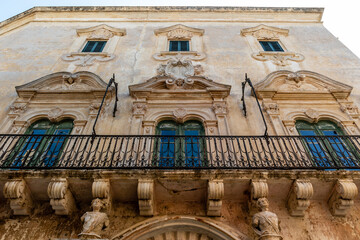 Facade of an old city palace in the old town of Gallipoli, Apulia, Italy