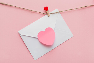 sting clothes peg with red heart and love letter on the rope