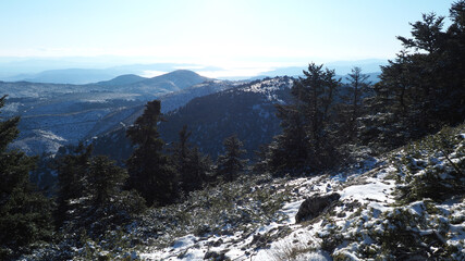 Breathtaking scenic view to whole Athens - Attica from snowed peak of Parnitha mountain, Greece