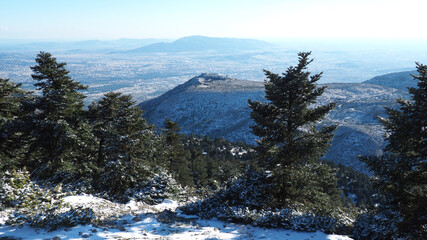 Breathtaking scenic view to whole Athens - Attica from snowed peak of Parnitha mountain, Greece