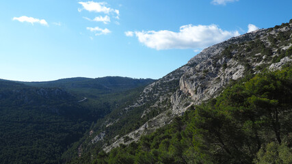 Fototapeta premium Beautiful mountain of Parnitha on a winter cloudy morning with clear blue sky, Attica, Greece