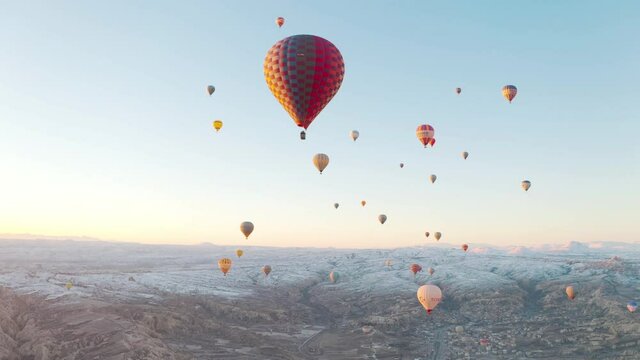 Aerial view of fairy chimneys. Flight hot air balloons in Cappadocia. 4K Footage