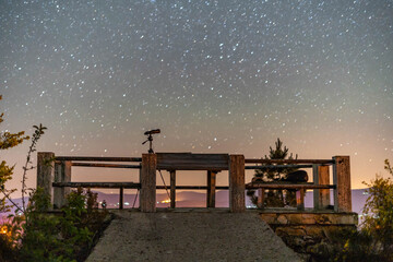 Night sky with the Milky Way over a lookout point 