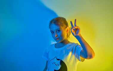 Little girl smiling over ocher background