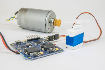 electric motor connected to an electronic control board and a servo motor