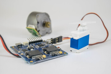 electric motor connected to an electronic control board and a servo motor