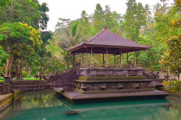 Fototapeta na wymiar Gazebo in the middle of the lake at Pura Tirta Empul. Bali, Indonesia