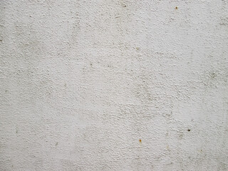Textured white wall. Light rough surface with graininess.