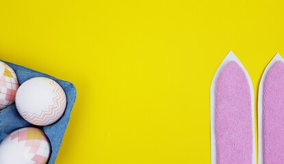 beautiful Easter eggs and bunny ears with a light background. an image for celebrating Easter. there is a place for both the label and the text.