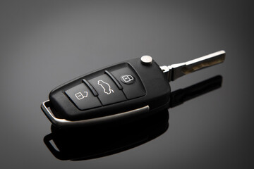 
Car ignition key on gray gradient background