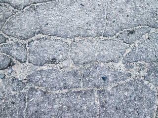 Cracks in the asphalt. Street photo for overlay and damage effect.