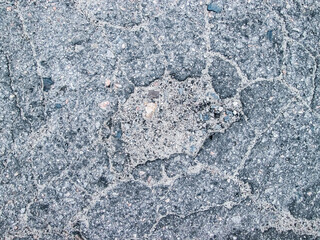 The texture of the old asphalt with a pit. Image for overlays.
