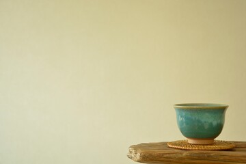 tea bowl. put on a floating shelf. This is a very fine example of Japanese traditional. lay out  vintage ceramic “ hagi ware ”. blurred background with copy space.