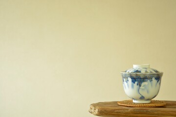 picture rice bowl. put on a floating shelf. This is a very fine example of Japanese traditional. lay out  vintage ceramic “ imari ware ”.  blurred background with copy space.