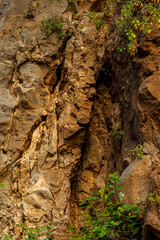Natural wall of brittle rocks