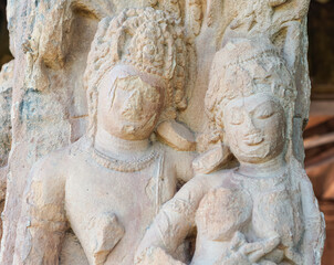 Aihole, Karnataka, India - November 7, 2013: Durga Gudi or Temple. Chest and face closeup of white...