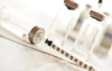 syringes and medicine in small sterile vials