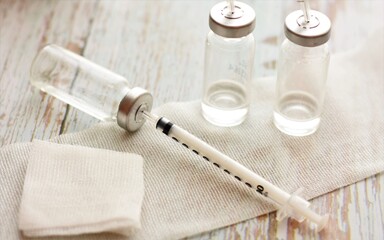 syringes and medicine in small sterile vials