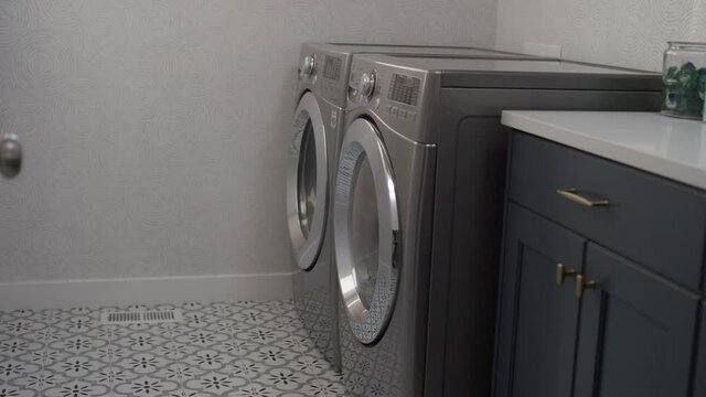 Looking into the laundry room of a home with front loading washer and dryer
