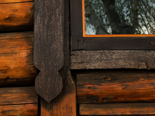 Part of the window of a wooden old house. High quality photo