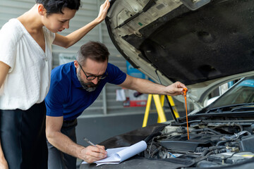 The mechanic talking with customer female