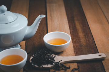 Bird eye view of tea cup suit, with copy space for text wodden background