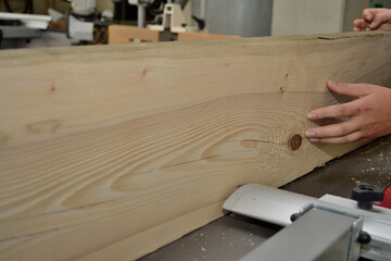 Wooden Board Is Treated By Carpenter With A Planer