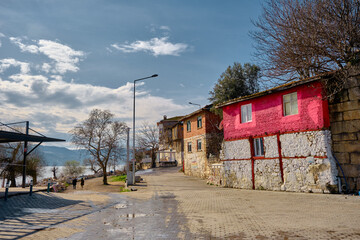 22.01.2021. Bursa. Golyazi (Apolyont). Turkey. Old style and colorful houses made of mud and stone in the lake and huge mountain background. 
