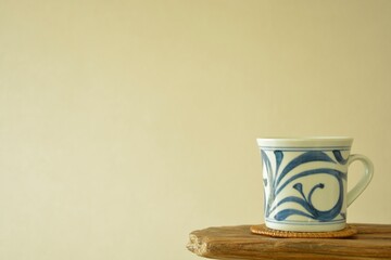 picture mug. put on a floating shelf. This is a very fine example of Japanese traditional. lay out  vintage ceramic &ldquo; tobe ware &rdquo;.  blurred background with copy space.