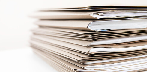 Extremely Close up Stack of Documents Folders on Office Desk Waiting to be Completed
