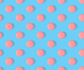 macarons seamless pattern. macarons isolated on blue background.